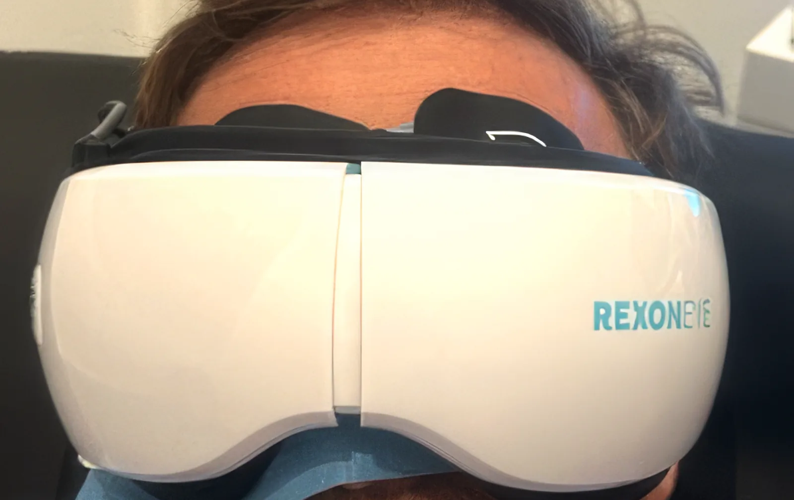 Patient wearing the Quantum Molecular Resonance eye mask during a treatment session
